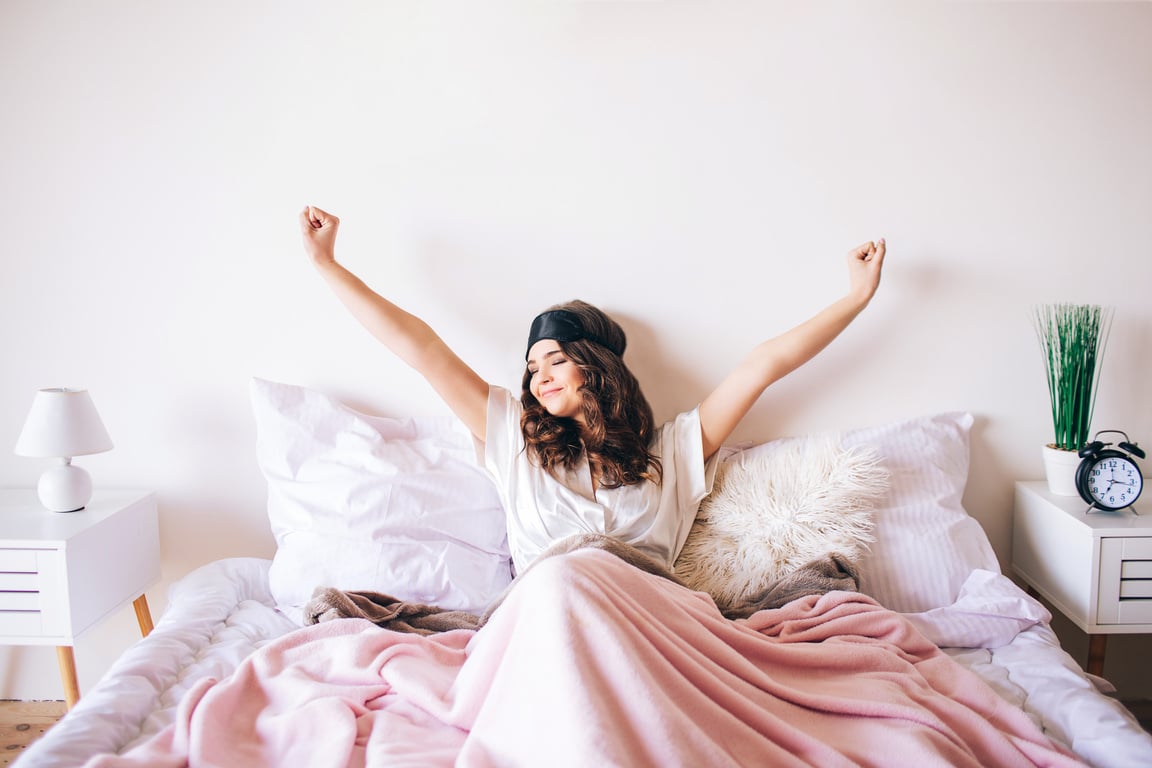 Woman Waking Up and Stretching Arms